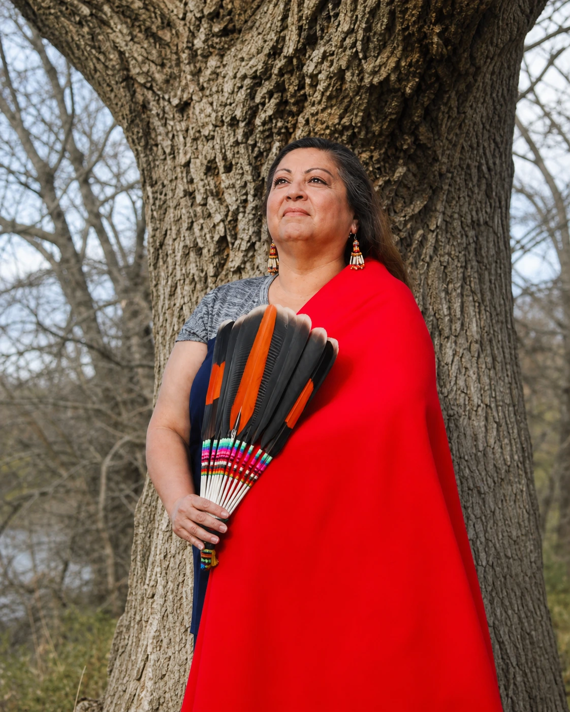 Jacquie Garza Lawrence centered in a warm editorial portrait.
